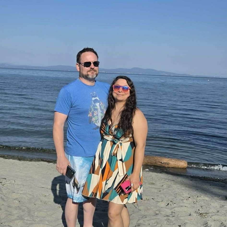 Ken Calvert and Joy, Owners of Handsome Dan's, on the beach